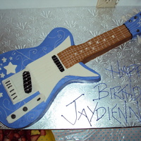 Hannah Montana Guitar the cake wascarved from a 11x15 sheet cake, covered in buttercream with mmf accents