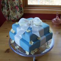 Morgan's Bridal Shower WASC with raspberry filling and MMF. All fondant. I wasn't too happy with this one, There were a ton of flaws! You can't see many...