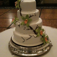 Becca the photo isn't super great cause i had to take it with my phone. but i liked the design she chose! white BC icing, piped branch,...