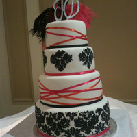 Kim damask stencil and criss crossing ribbon, fondant icing. thanks for looking!
