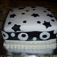 Birthday Cake Birthday cake done with fondant on the top half. Chocolate fondant for the black.