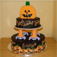 Halloween 1St Birthday Cake This was made for my friend's son's 1st birthday. The top jack o lantern was done to look more like a baby with the tiny teeth &...