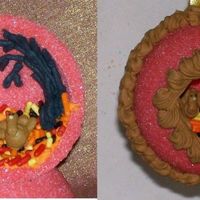 Sugar Ornament With Ri Turkies A 2" sugar ornament I made. I piped the turkies on foil first, then when they were dry, I assembled the neck to the body and put it in...