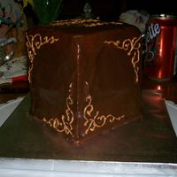 First Attempt At Ganache And Gold Piping Gel I made this for a friend's birthday- chocolate cake, chocolate hazelnut buttercream filling and milk chocolate ganache. This is my...