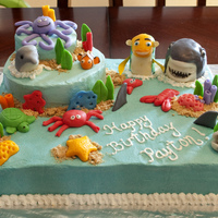 Payton's 4Th Birthday Cake My son requested a Shark Tales cake. I didn't really want to make a shark cake, so I just made an under the sea cake and stuck Oscar &...