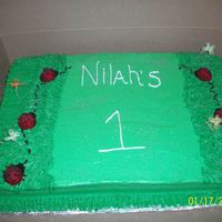 Lady Bug Cake Lady Bugs made from sugar molds (it was my first time) and my first time using the tip to make grass. All BC icing.