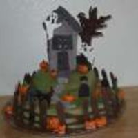 Haunted House Cake Made this cake for a cake walk at my daughters school. You can't really see it but there is a battery operated tea light inside the...
