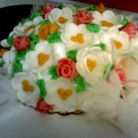 1St Anniversary This cake was made to look like her wedding bouquet. this is me learning to make flower. was not spot on but they were very gracious any...