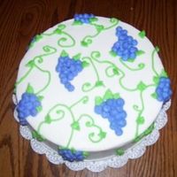 Grape Cake this was my end of course 1 cake. since wilton violet icing color really comes out blue, i bought the pre made wilton violet color. it was...