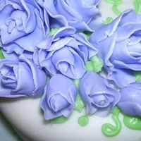 Closer Pic Of Fondant Roses just wanted yall to see the pretty pearl dust on my roses! im pretty proud of my cake. lol
