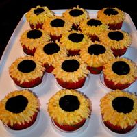 Sunflower Cuppies I think I looked at every sunflower cuppy on CC to get ideas for these! Lemon cake with buttercream petals and fondant centers (molded but...