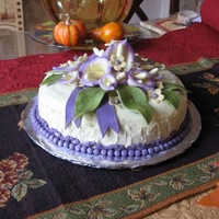 Calla Lilly Birthday Cake "8 dome, white chocolate/almond cake with almond frosting. Fondant flowers/leaves.