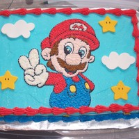 Super Mario This is a 1/4 sheet cake iced with buttercream. The stars and clouds are fondant.