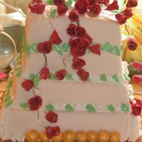 Red Roses Weddingcake Red Roses, RI accents filled with tobleronemousse.My first weddingcake! TFL!