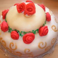 Marsepine Roses First time I used marsepine and BC. The BC was not smotth so I covered the whole cake in marsepine. :)Cake with nuts and Tobleronefilling...