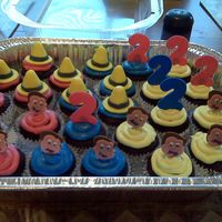 Curious George Cupcakes Inspired by cupcakes by joey2jack on here. Chocolate with MMF decorations affixed to lollipop stix with Royal Icing. Matching cake in my...