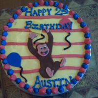 Curious George Chocolate cake with buttercream. MMF George and Balloons. This was a blast to make. Matching cupcakes in my pictures.