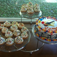 Xavier's 6Th Birthday Cake 8 inch chocolate cake with buttercream icing. Vanilla cupcakes with buttercream. Iced to match the party invitation.