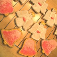 Angels And Bells Basic sugar cookie decorated with royal icing and sanding sugar.