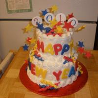 New Year Cake I made this for a family celebration. The first time using lots of fondant embellishments (fondant mixed with Tylose). Cake was iced in...