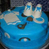 Baby Boy Blue This was my first time making fondant baby booties, onesies, and rattle w/bow, it was funto make I loved the colors she picked brown and...