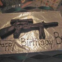 Sniper Rifle Cake chocolate cake shaped like a sniper rifle, i carved it out of a sheet cake