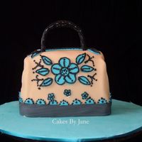 Purse Cake I went to saks firth avenue website to see the lastest designs for purses. I made a hummingbird cake. Covered the fondant. I lost one cake...