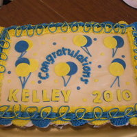 Graduation Cupcake Cake 67 cupcakes, covered in buttercream with fondant balloons and lettering