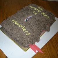 Monster Book Of Monsters gumpaste teeth and tongue. chocolate eyes, buttercream "hair" on top of fondant.