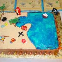 Pirate Cake I made this for my sons 6th birthday. Half strawberry, half chocolate cake with buttercream frosting. The sand is vanilla wafers and the...