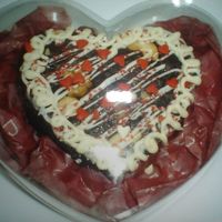 Giveaways At My Daughter's 1St Birthday fudgy triple chocolate brownies with cashew, decorated with white chocolate and heart sprinkles