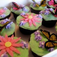 Butterfly & Flower Cupcakes Rice paper butterflies, buttercream frosting, sanding sugar, gum paste flowers.