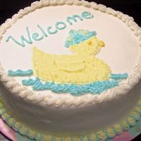 Ducky Baby Shower Here's a quick cake I made for a friend. White cake with extender, plain BC. I tinted the filling blue for a surprise when they cut...