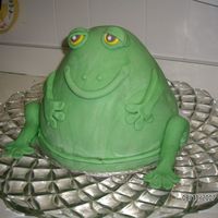 Froggie Goes A Courtin 10" round and bell shaped pan covered in fondant. At the wedding he willhave a red sequin bow tie and a gold crown.
