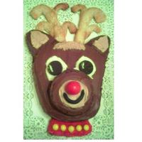 Reindeer Cake I saw this Woman's World magazine. I made 5 of these this week! Whew! Big Big hit though. The antlers are refridgerated bread sticks...
