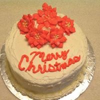 Christmas Pointsettia Inital top tier to the final cake in Wilton Course 3. Had 2 parties to go to that weekend so I split them up and use this smaller cake for...
