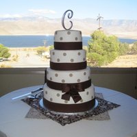 Chappell Wedding My very first wedding cake. Covered in Satin Ice fondant. Fondant dots. 50/50 fondant gumpast for the bow. Cakes are 12", 10", 8&...