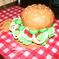 Hamburger And Fries used a couple of large round pans for the bottom "bun" and "patty". Bun is a yellow cake and the patty is a brownie....