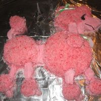 Pink Poodle I used a couple of round pans and then cupcake tops for the "puffs". Then colored coconut for the body and put a little pink...