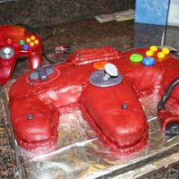 Nintendo Controller Just used an oblong pan and created a template for the shape. Covered with marshmallow fondant and decorated with the leftover fondant. My...