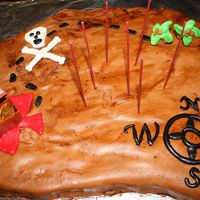 Pirate Map I made the shape from 2 oblong pans and cut the outline. Marshmallow fondant is on top and I used a watered down brown coloring to "...