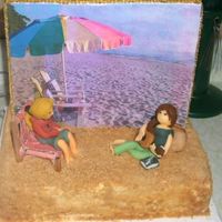 Beach Scene This is the back side of the cake I made for the Hannah Montana cake. It's a beach scene as you can tell with Miley and Lilly. It'...
