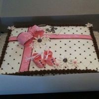 Pink And Brown Sheet Present WASC with strawberry filling. Gumpaste bow and baby shoes, the flowers and the ribbon are made of MMF. tfl