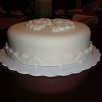 1St Fondant Cake This is practice from a 2 hour class (not Wilton) from a local specialty store. White cake, raspberry buttercream filling, Wilton fondant....