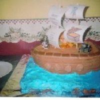 Pirate Ship Pirate ship sitting in water with a toy pirate, toy cannon, toy treasure chest, and chocolate foil coins on deck. Sails were dowel rods...
