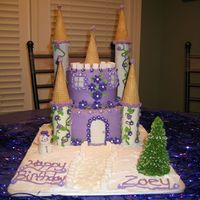 Princess Castle Cake This is a Princess Castle cake with Snow since Zoey's Birthday is right before Christmas. The cake is a 9inch round on bottom with a...