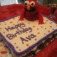 Elmo Cupcake Cake This is a Elmo Cupcake cake. Chocolate Cupcakes filled with Whipped Buttercream and vanilla Buttercream icing.