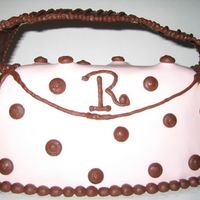 Purse.jpg This is a strawberry cake with Strawberry Marshmallow fodant and chocolate buttercream accents. This is my first purse cake and I learned a...
