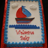 Sailboat Baby Shower Made to match baby bedding. I put the baby's name "Lane" on the boat. Buttercream with fondant accents.