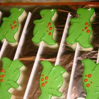 T-Rex Cookie Pops These went with a T-Rex cake for a 5th birthday. They are NFSC iced in royal.